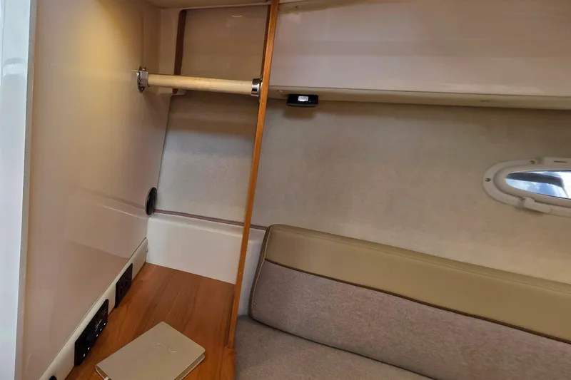 Slide: The Image of Interior cabin of 2027 Cutwater C-248 Coupe, featuring seating and a small window. - 20