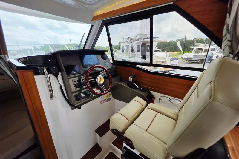 Slide: The Image of Interior of 2027 Cutwater C-248 Coupe boat, featuring helm and luxurious seating. - 17