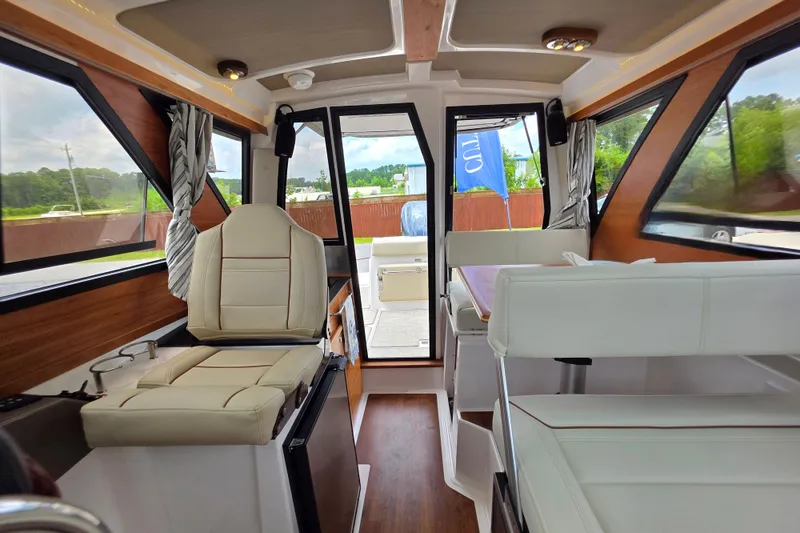 Slide: The Image of Interior of 2027 Cutwater C-248 Coupe, featuring modern seating and panoramic windows. - 26
