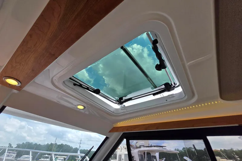 Slide: The Image of 2027 Cutwater C-248 Coupe interior with skylight, showcasing modern design and natural lighting. - 30