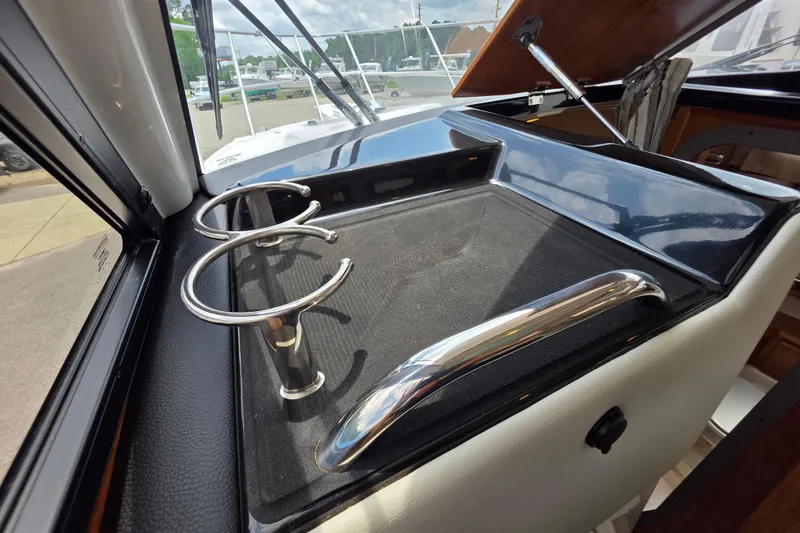 Slide: The Image of Interior view of 2027 Cutwater C-248 Coupe boat with cup holders and sleek design. - 23