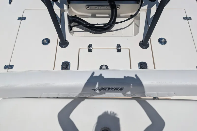 Slide: The Image of 2022 Hewes Redfisher 18 boat interior with shadow and logo detail. - 17