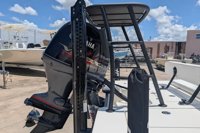 Slide: The Image of 2022 Hewes Redfisher 18 boat with Yamaha outboard motor in a marina. - 28
