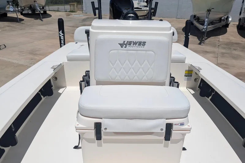 Slide: The Image of 2022 Hewes Redfisher 18 boat interior with white cushioned seating. - 19