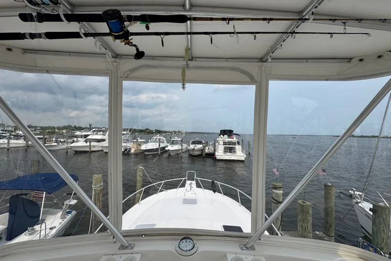 Slide: The Image of 2004 Luhrs 38 Convertible yacht docked at marina, view from helm. - 38
