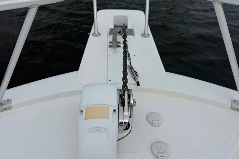 Slide: The Image of Bow of 2004 Luhrs 38 Convertible boat with anchor chain and winch. - 41