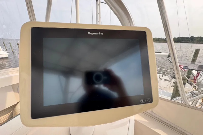 Slide: The Image of Raymarine display on 2004 Luhrs 38 Convertible boat, docked by the water. - 33