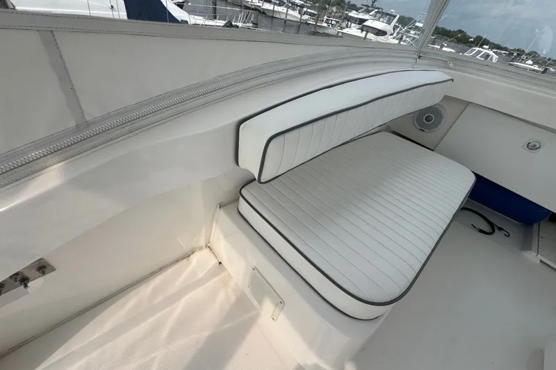 Slide: The Image of White seating area on a 2004 Luhrs 38 Convertible boat deck. - 39