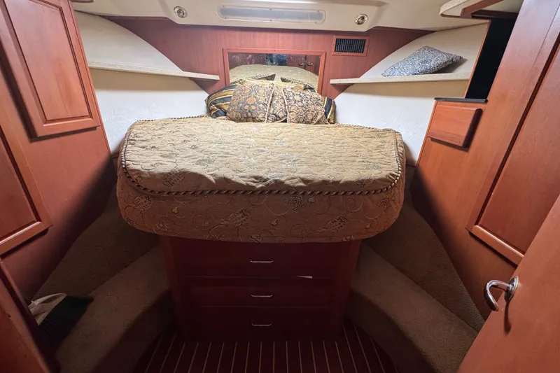 Slide: The Image of Luxurious cabin interior of 2004 Luhrs 38 Convertible yacht with cozy bedding. - 27
