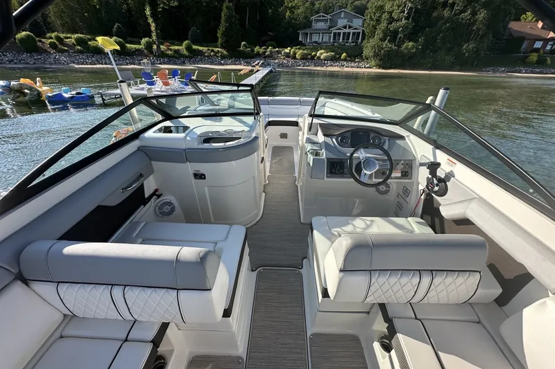 Slide: The Image of 2017 Sea Ray SDX 270 boat interior with luxurious seating and modern dashboard. - 8