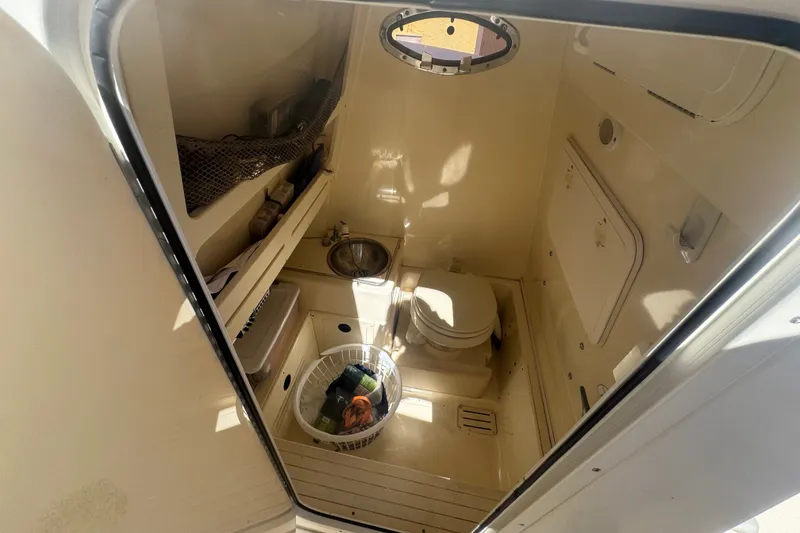 Slide: The Image of 2008 Scout 282 Sportfish boat interior with toilet and sink. - 36