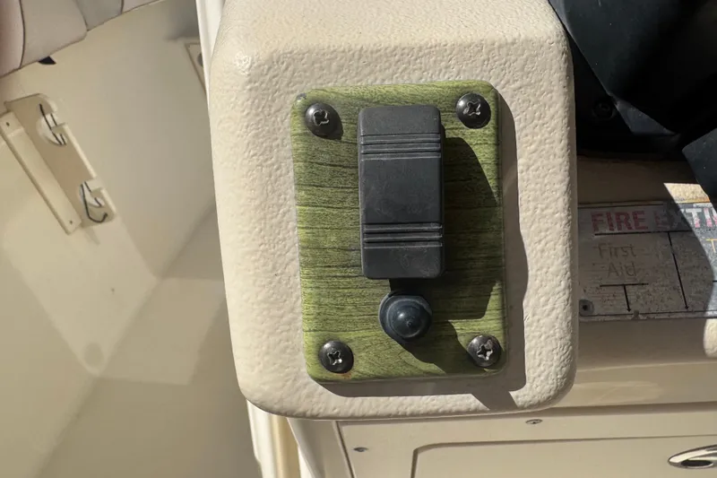 Slide: The Image of Switch panel on a 2008 Scout 282 Sportfish boat dashboard. - 22