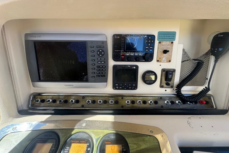 Slide: The Image of Control panel of a 2008 Scout 282 Sportfish boat with Garmin and Icom electronics. - 49