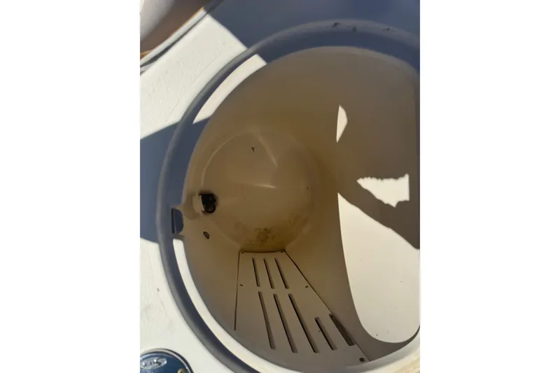 Slide: The Image of Livewell interior of 2008 Scout 282 Sportfish boat, showing drainage and storage features. - 17