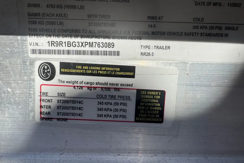 Slide: The Image of 2008 Scout 282 Sportfish trailer label with tire and loading information, VIN, and weight limits. - 78