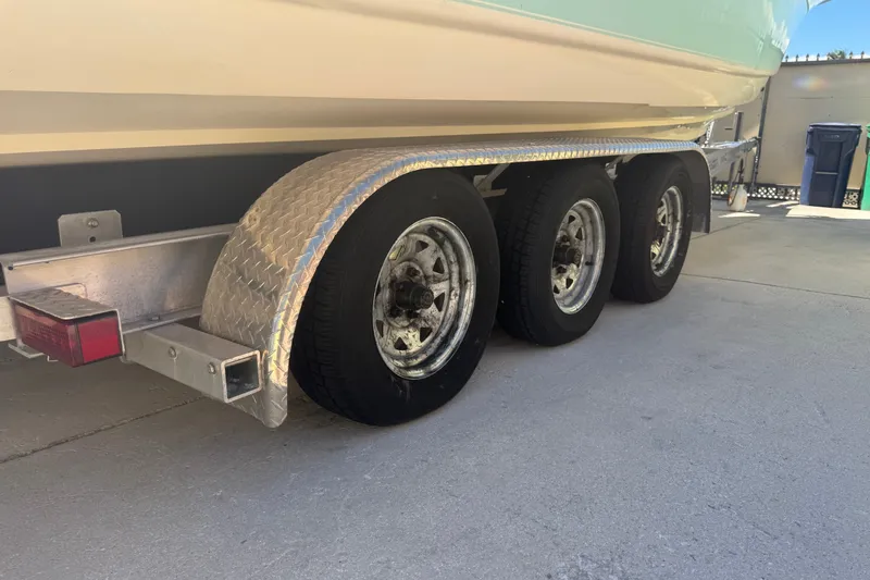 Slide: The Image of Trailer with triple axles for 2008 Scout 282 Sportfish boat. - 79