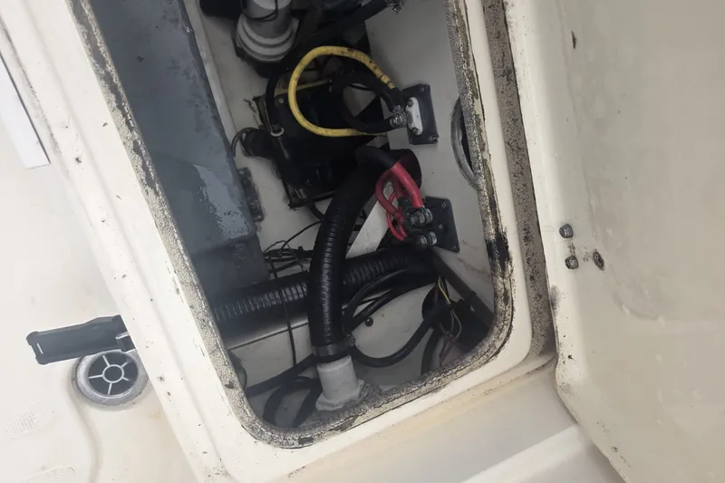 Slide: The Image of Electrical compartment of a 2008 Scout 282 Sportfish boat, showing wiring and components. - 13