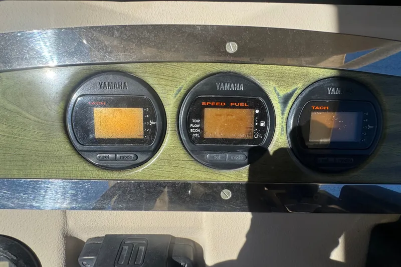 Slide: The Image of Yamaha gauges on 2008 Scout 282 Sportfish dashboard, displaying tachometer and speed fuel data. - 53