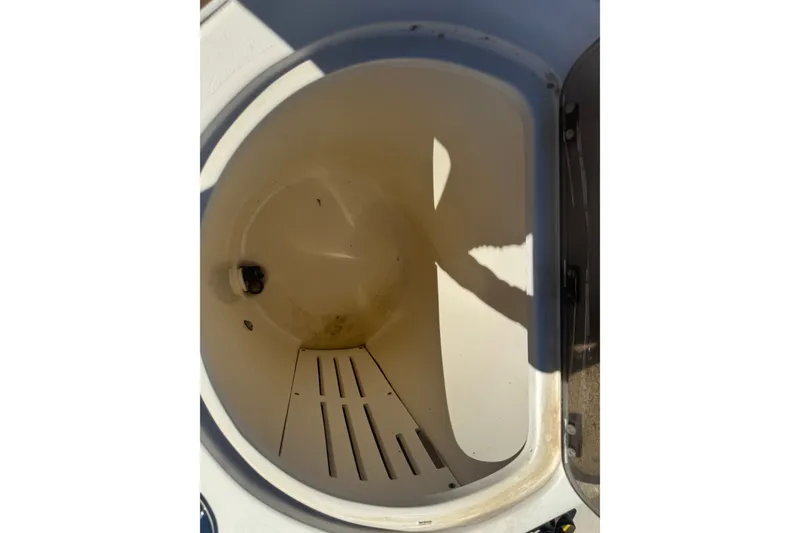 Slide: The Image of Open storage compartment on 2008 Scout 282 Sportfish boat, showing interior details. - 19