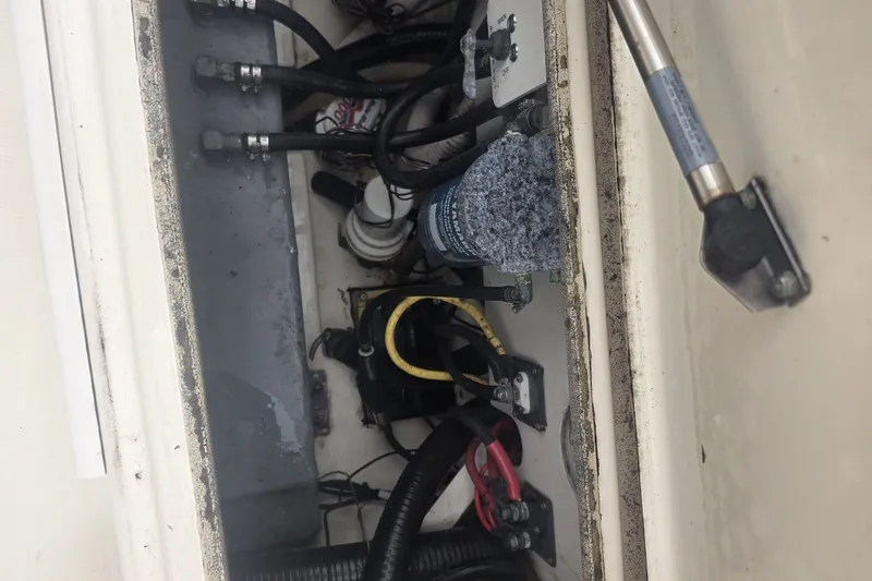 Slide: The Image of 2008 Scout 282 Sportfish boat compartment with wiring and components. - 9