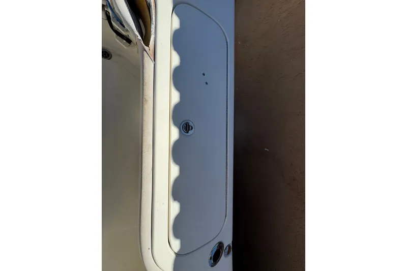 Slide: The Image of 2008 Scout 282 Sportfish boat deck with storage compartment and latch. - 66