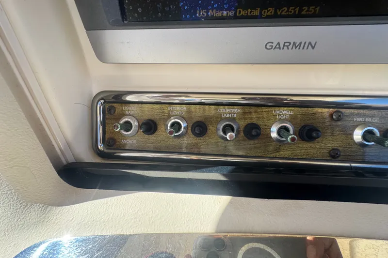 Slide: The Image of Control panel of a 2008 Scout 282 Sportfish boat with Garmin display. - 45