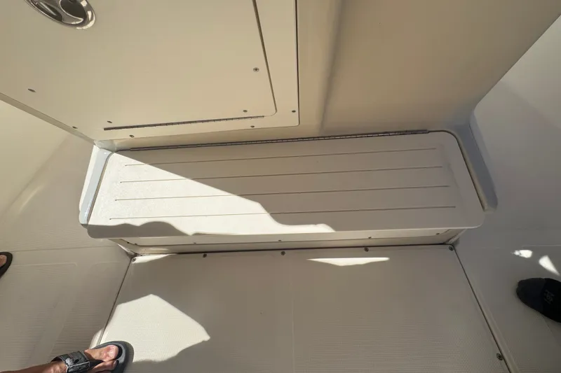 Slide: The Image of 2008 Scout 282 Sportfish interior with seating and storage compartment. - 39