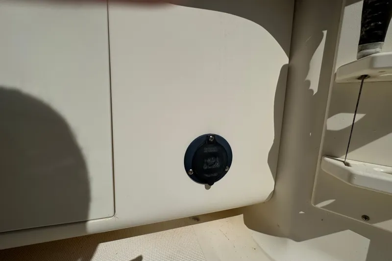 Slide: The Image of 2008 Scout 282 Sportfish boat detail showing a washdown outlet. - 61