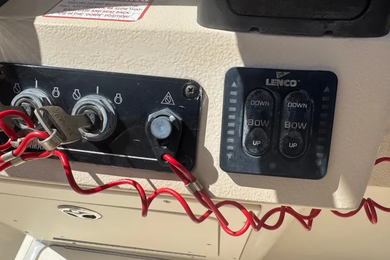 Slide: The Image of Control panel of a 2008 Scout 282 Sportfish boat with Lenco trim tab switches. - 23