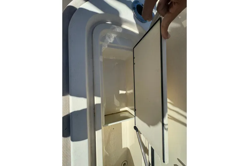 Slide: The Image of Open storage compartment on a 2008 Scout 282 Sportfish boat. - 67