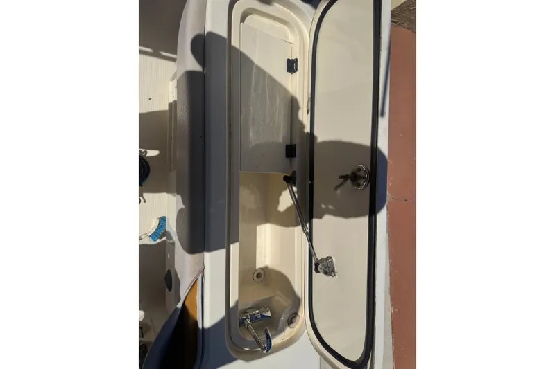 Slide: The Image of Open storage compartment on a 2008 Scout 282 Sportfish boat. - 70