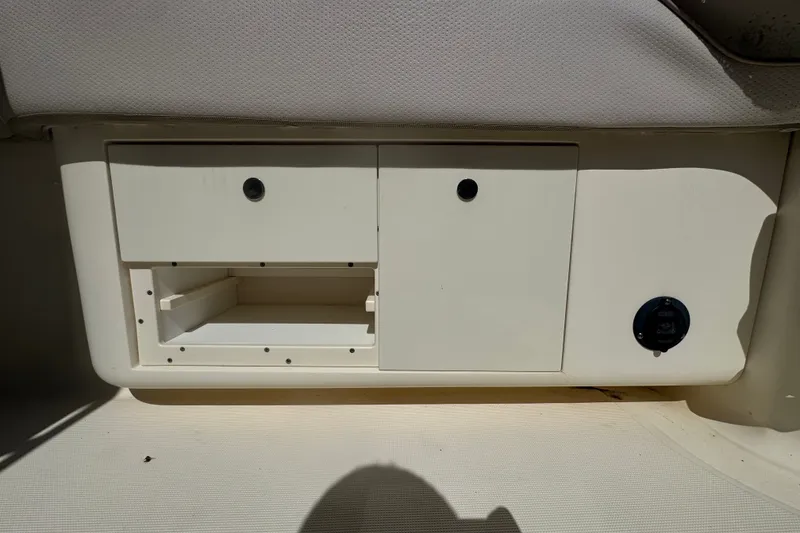 Slide: The Image of Storage compartment on a 2008 Scout 282 Sportfish boat interior. - 60