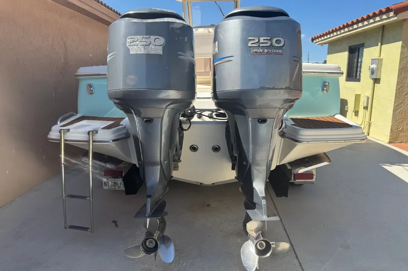 Slide: The Image of 2008 Scout 282 Sportfish boat with twin 250 horsepower outboard engines. - 4