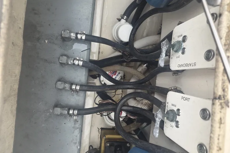 Slide: The Image of Electrical wiring and switches inside a 2008 Scout 282 Sportfish boat. - 12