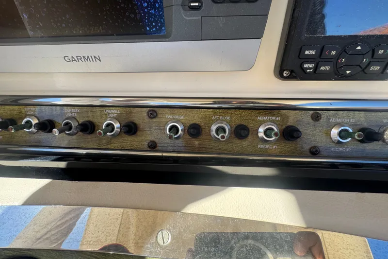 Slide: The Image of Control panel of a 2008 Scout 282 Sportfish boat with Garmin display. - 46
