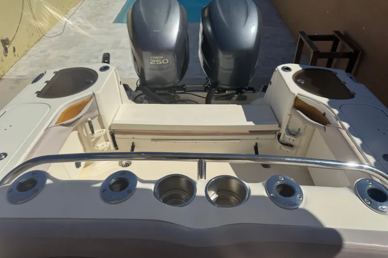 Slide: The Image of 2008 Scout 282 Sportfish boat with dual Yamaha 250 engines, featuring rod holders and storage. - 7