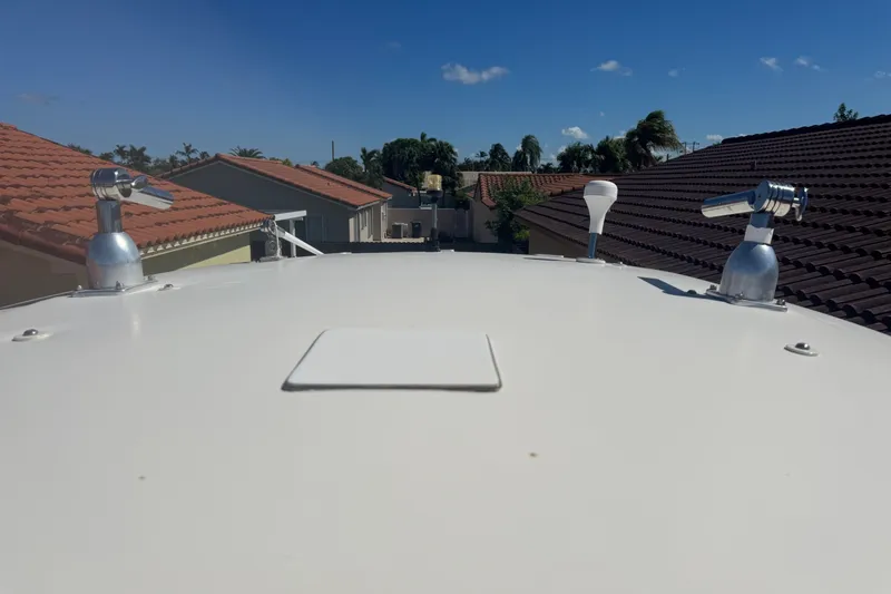Slide: The Image of Rooftop view of a 2008 Scout 282 Sportfish boat with clear blue sky. - 77