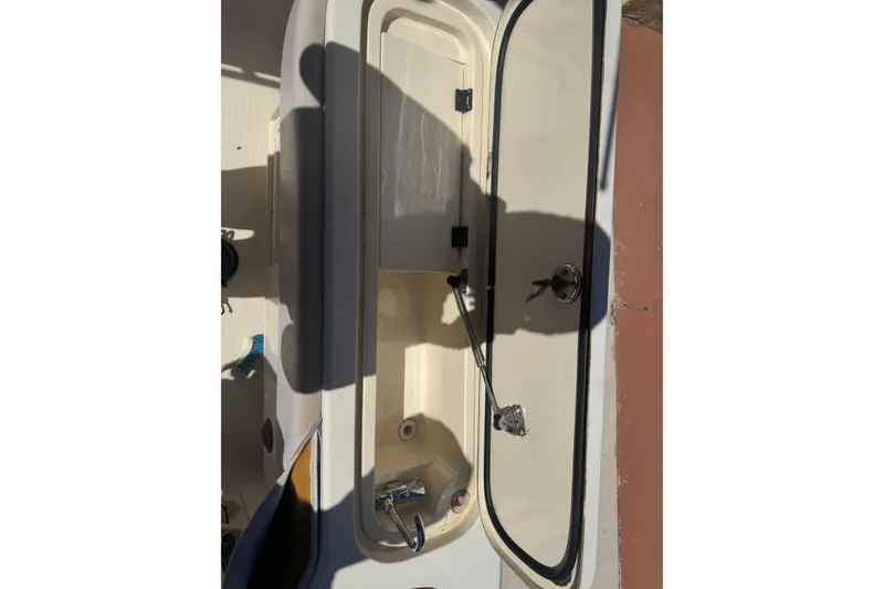 Slide: The Image of Open storage compartment on 2008 Scout 282 Sportfish boat, showing interior details. - 69
