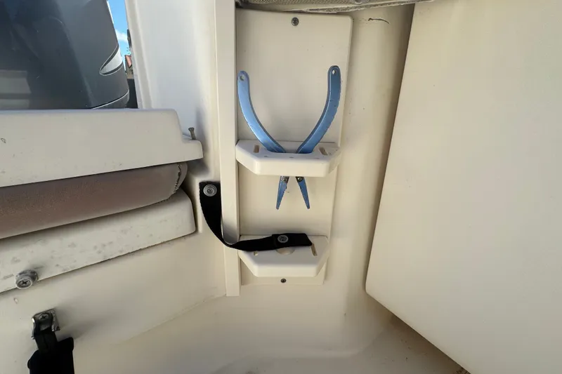 Slide: The Image of Storage area with blue pliers on a 2008 Scout 282 Sportfish boat. - 63