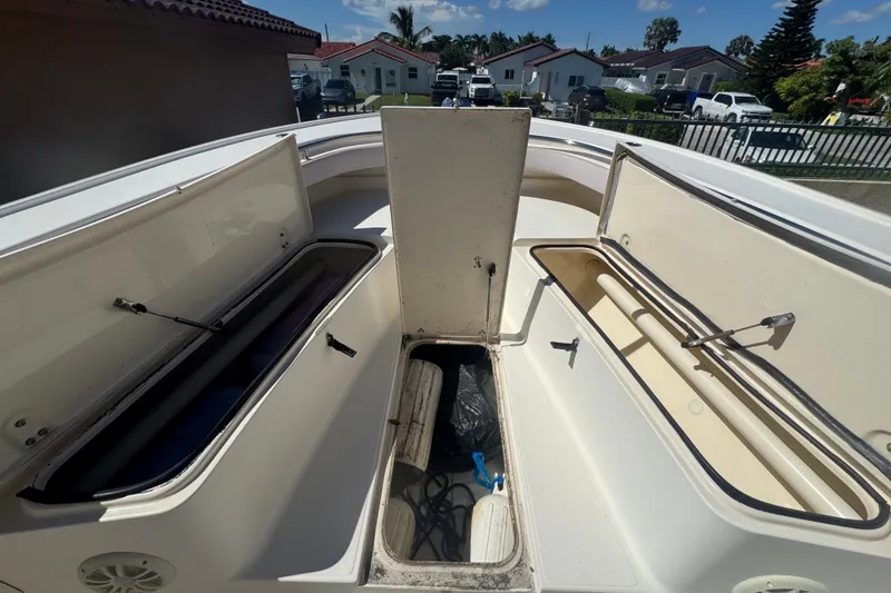 Slide: The Image of 2008 Scout 282 Sportfish boat storage compartments open, showcasing spacious interior. - 31