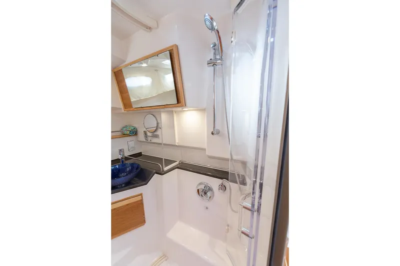 Slide: The Image of Luxurious bathroom in 2027 Cutwater C-32 CB yacht with modern fixtures and elegant design. - 33