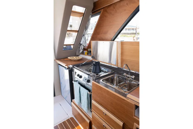 Slide: The Image of Modern kitchen interior of 2027 Cutwater C-32 CB boat with stove and sink. - 30