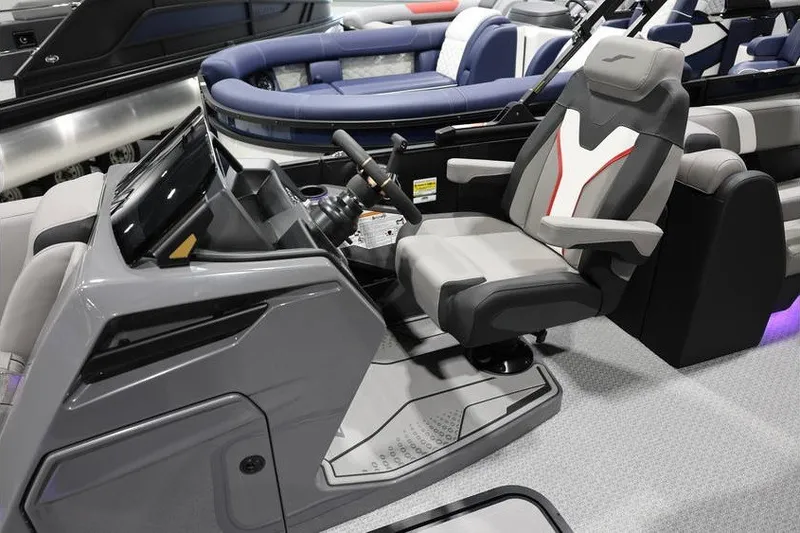 Slide: The Image of Interior of a 2026 Evotti 721QL boat featuring a modern helm and comfortable seating. - 8