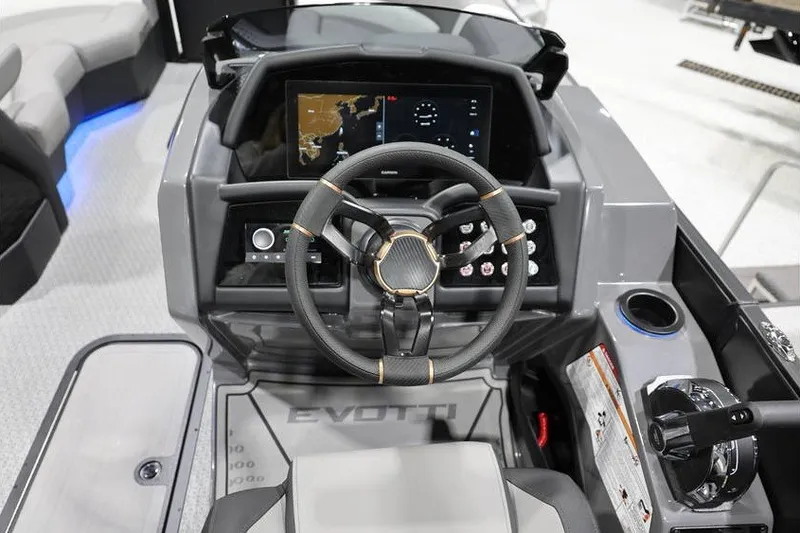 Slide: The Image of Cockpit of 2026 Evotti 721QL boat with modern steering and navigation display. - 16