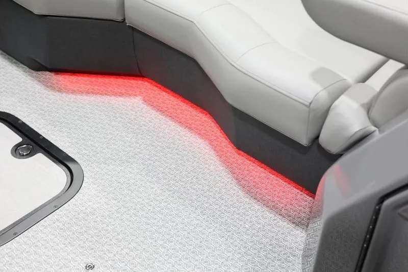Slide: The Image of Interior of 2026 Evotti 721QL boat with red LED lighting and white seating. - 18