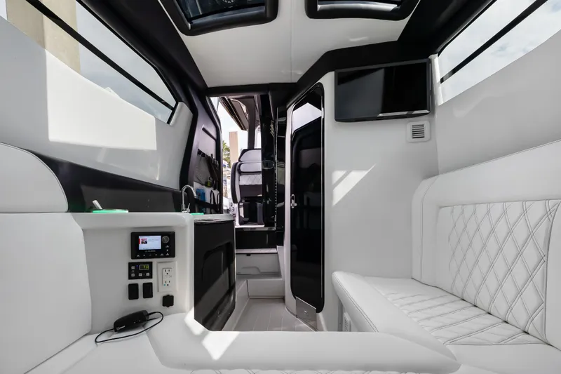 Slide: The Image of Luxurious interior of 2024 Nor-Tech 450 Sport boat with modern amenities and sleek design. - 30