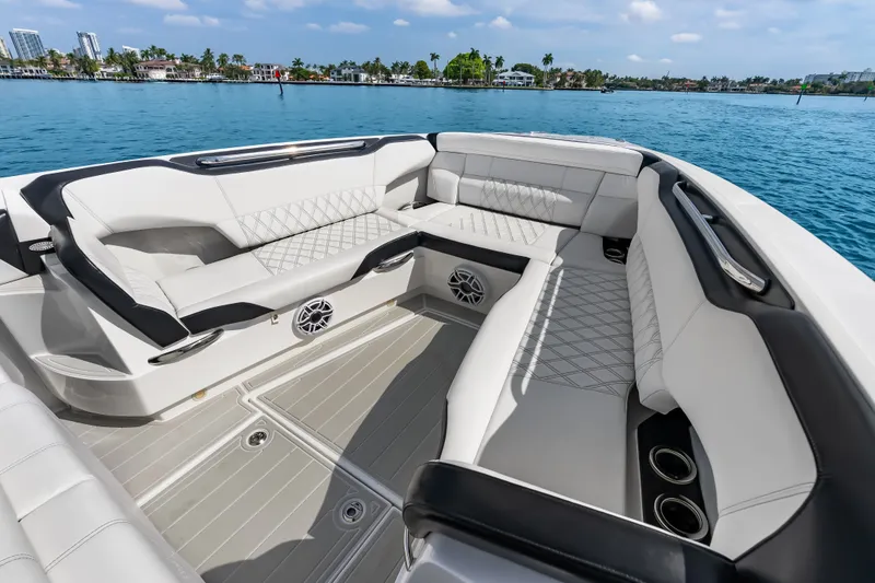 Slide: The Image of Luxurious seating on the 2024 Nor-Tech 450 Sport boat, with waterfront view. - 44