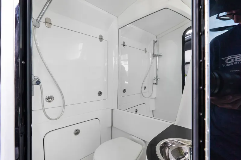Slide: The Image of 2024 Nor-Tech 450 Sport boat bathroom with modern fixtures and sleek design. - 31
