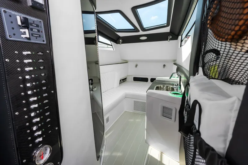 Slide: The Image of Luxurious interior of 2024 Nor-Tech 450 Sport boat, featuring modern amenities and sleek design. - 26