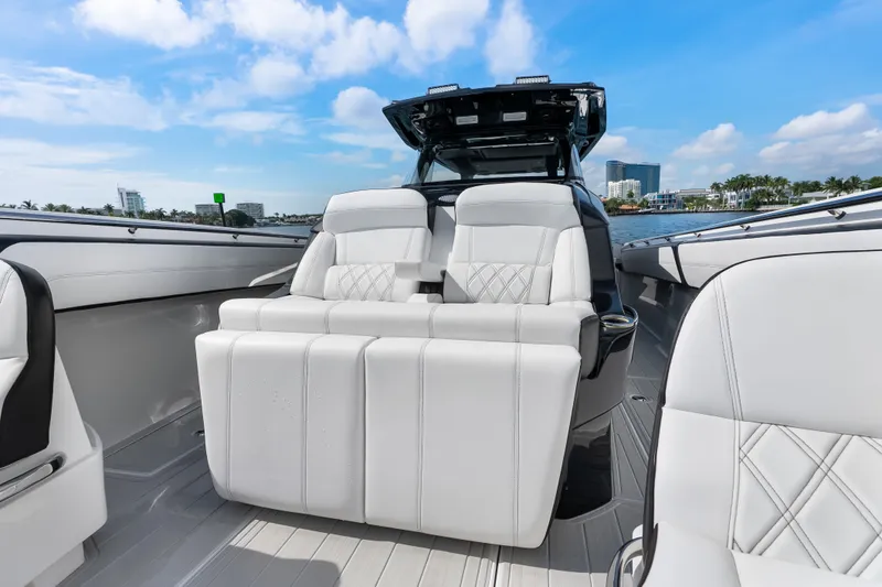 Slide: The Image of 2024 Nor-Tech 450 Sport boat interior with luxurious white seating and modern design. - 41